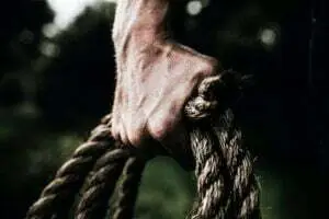 find your purpose as a woman, Amplify Your Message, Attract Clients, & Create Lasting Impact with Podcasts man holding brown rope - find your purpose as a woman