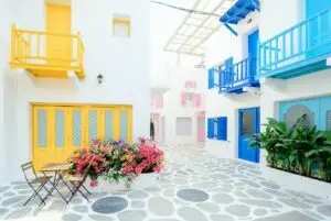find your purpose as a woman, Amplify Your Message, Attract Clients, & Create Lasting Impact with Podcasts architectural photography of three pink blue and yellow buildings