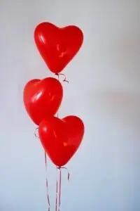 things you tell yourself, Amplify Your Message, Attract Clients, & Create Lasting Impact with Podcasts three red heart balloons